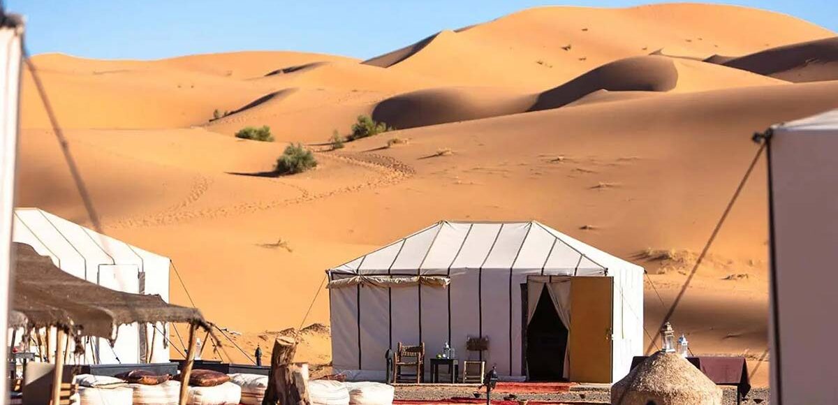Sahara desert camp tents in the golden Erg Chebbi dunes near Merzouga
