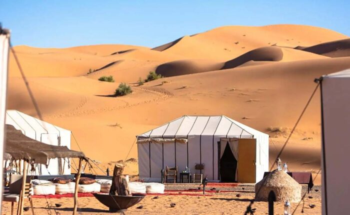 Sahara desert camp tents in the golden Erg Chebbi dunes near Merzouga