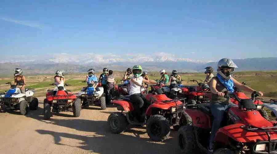 A group of quad bikers ready to explore, with the Atlas Mountains as a backdrop.