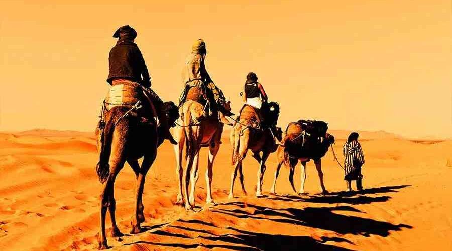 Camel trekking in Erg Chebbi during your Moroccan Sahara tour from Marrakech to Fes