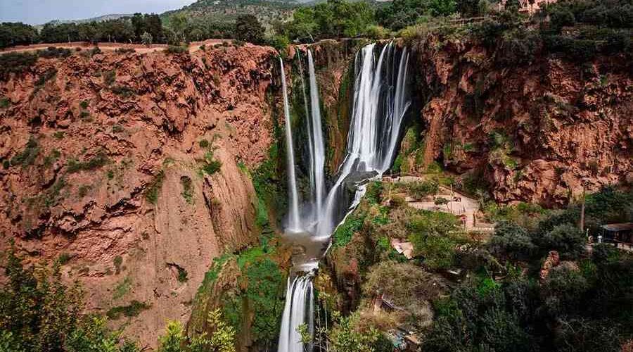 The breathtaking Ouzoud Waterfalls cascading down rugged cliffs in Morocco.