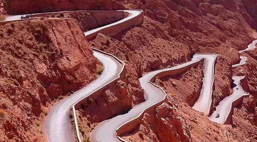 The road through Dades Valley Gorges winds and zigzags, carving its way through the rugged terrain.
