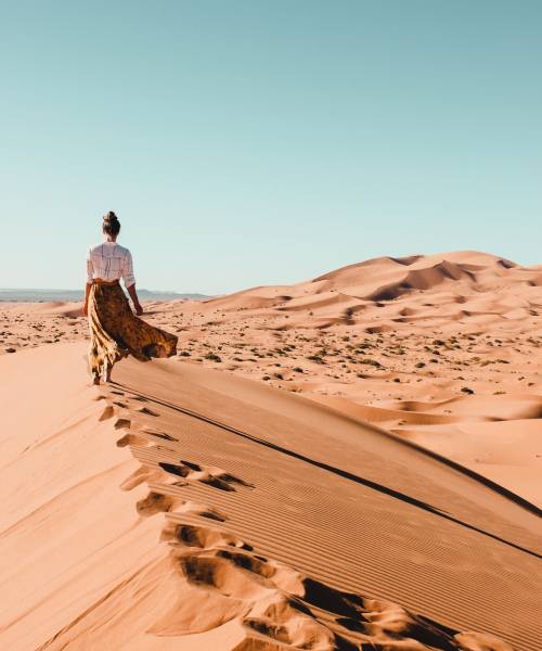 Lady enjoying her private Morocco Desert tour in Merzouga dunes