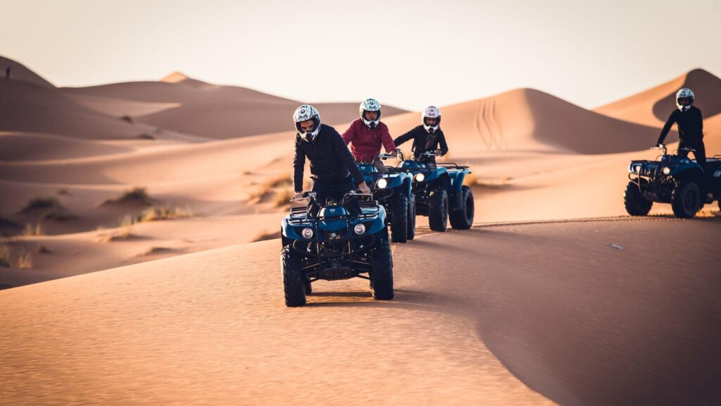 Quad biking in Morocco Sahara desert dunes