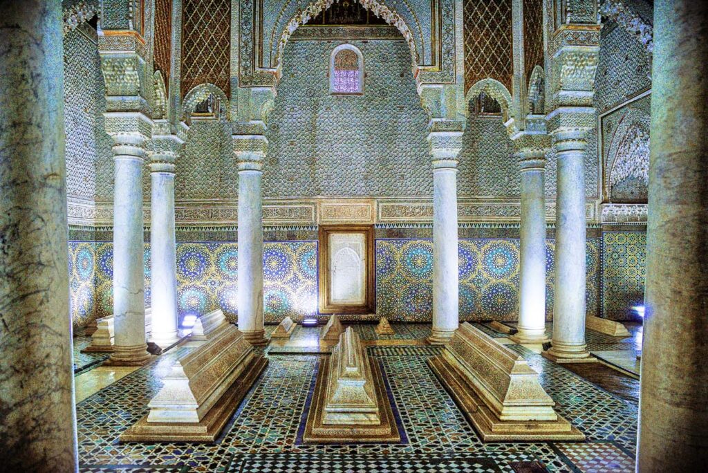 Interior of the Saadian Tombs with ornate mosaic tiles and marble columns in Marrakech.