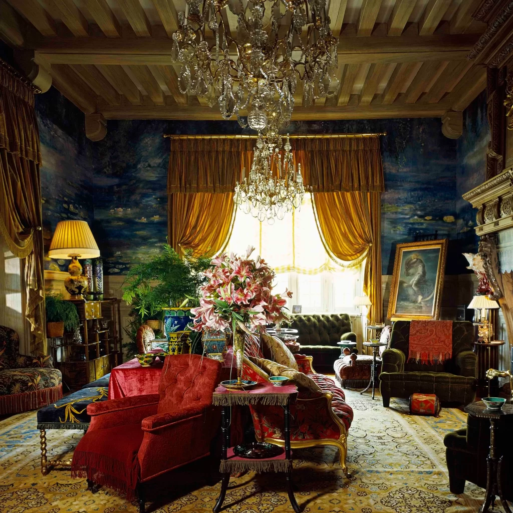 Luxuriously decorated living room of Yves Saint Laurent's house in Marrakech, showcasing opulent furnishings and a grand chandelier.