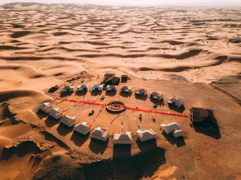Aerial view of a luxury Morocco Sahara desert camp in Merzouga dunes