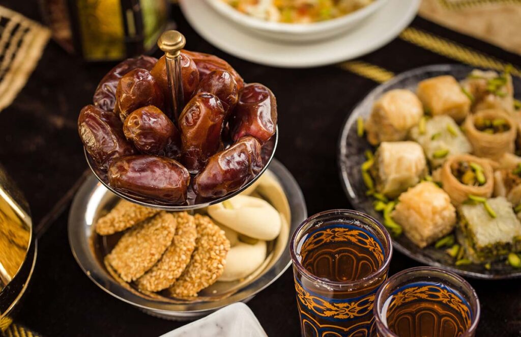 Traditional Moroccan Eid sweets and tea on a festive table