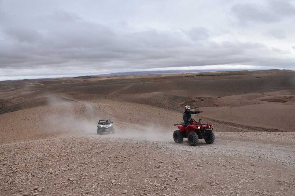 Quad biking adventure across rocky landscapes of Agafay Desert near Marrakech.
